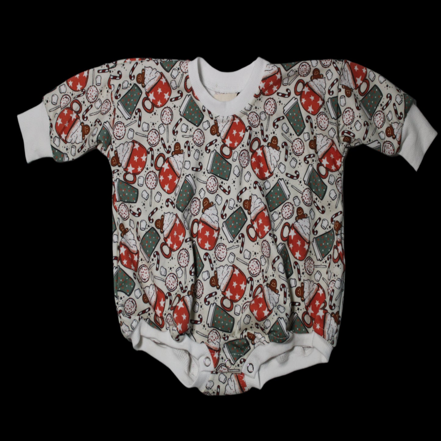 A short-sleeved baby shirt with a Christmas-themed pattern, featuring mainly red and green colors with Santa Claus and gingerbread designs.
