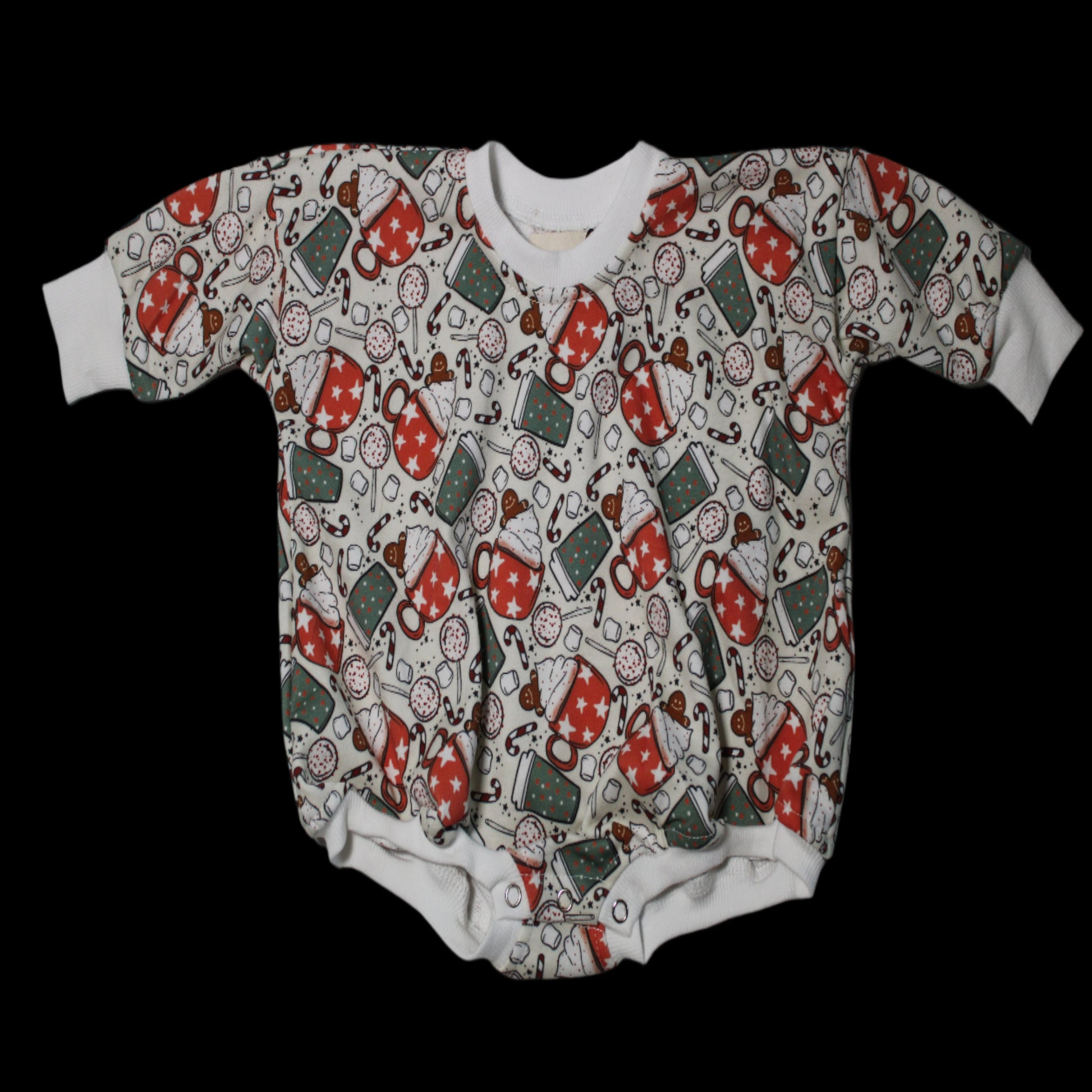 A short-sleeved baby shirt with a Christmas-themed pattern, featuring mainly red and green colors with Santa Claus and gingerbread designs.